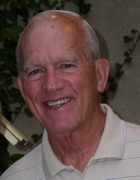 A close-up of a man smiling