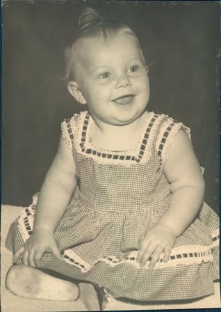 A baby in a dress