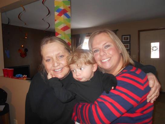 A group of women holding a baby