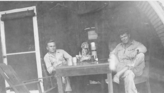 A group of men sitting at a table