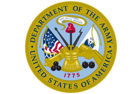 A gold emblem with a flag and a cross