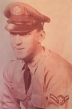 A historical officer dressed in uniform sits for a formal portrait with a serious expression.