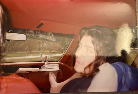 A man sitting in a car