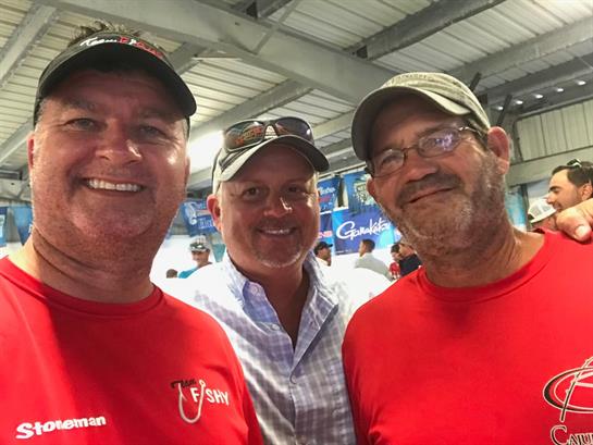 A group of men smiling for a photo