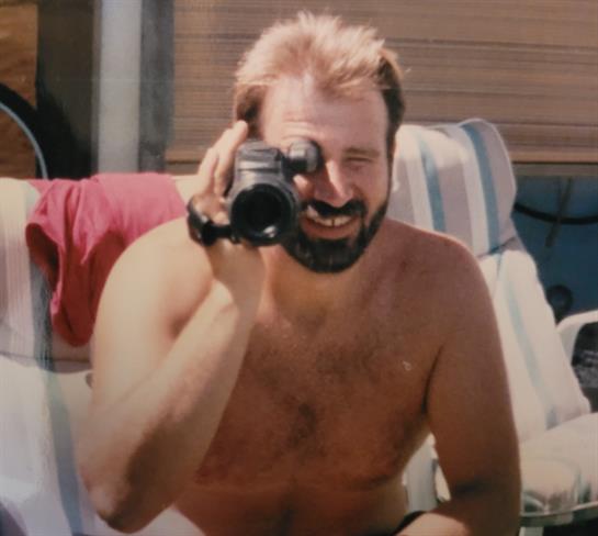 A man holding a camera