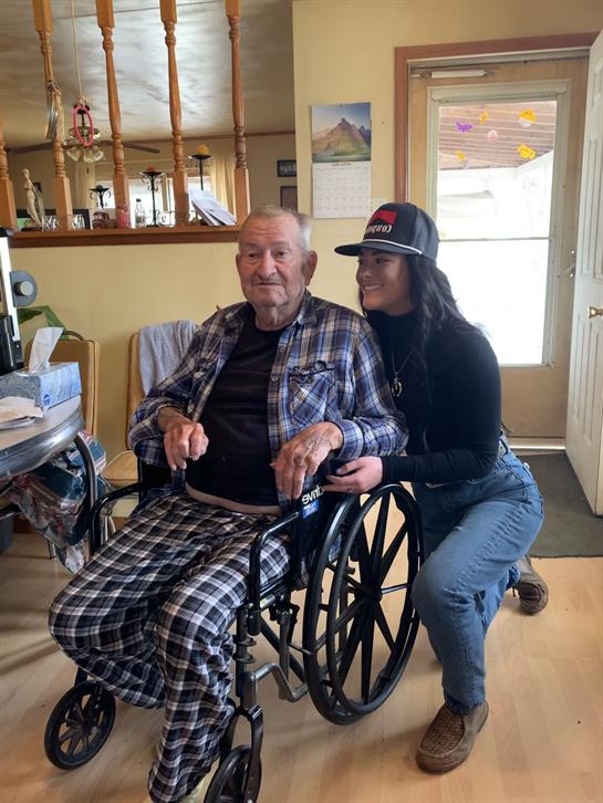 A man in a wheelchair with a woman