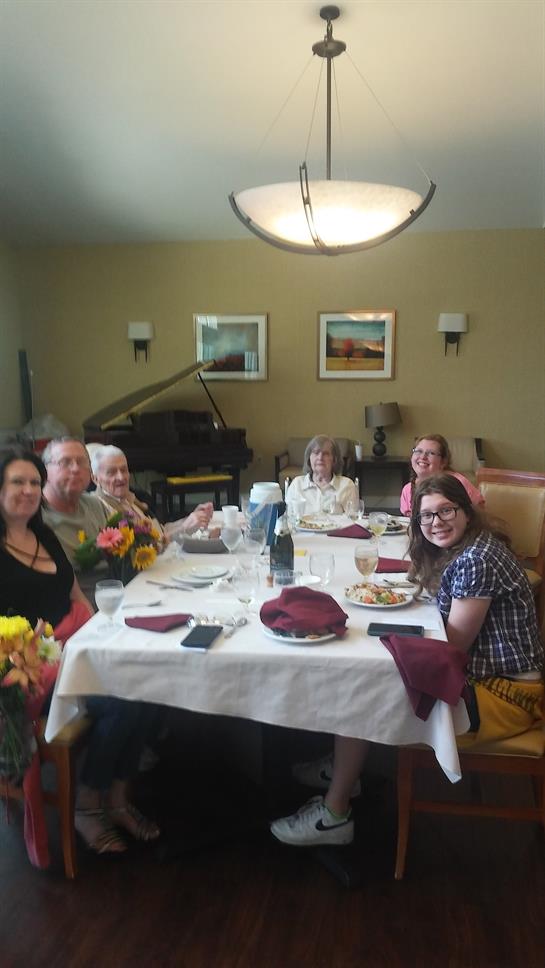 A group of people sitting at a table