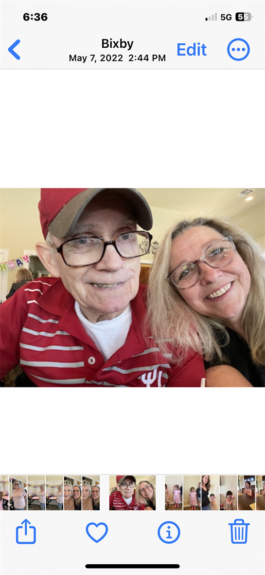 Two people share a happy moment together in a lively interior, celebrating an occasion.