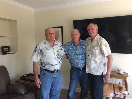 A group of men posing for a picture