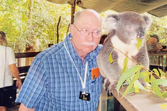 A man with a koala bear