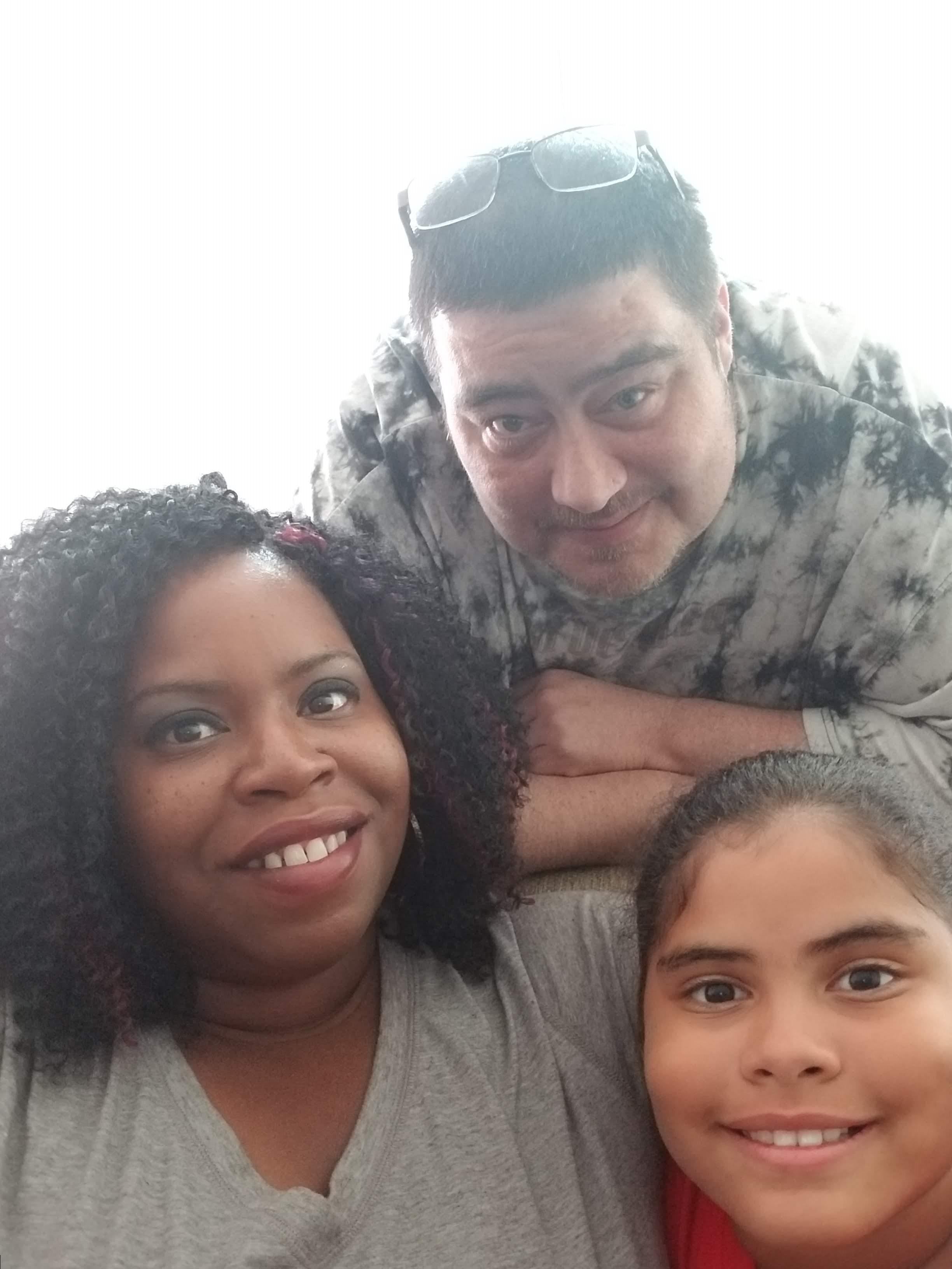 A group of people posing for a selfie