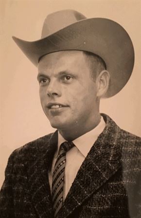 A man wearing a cowboy hat