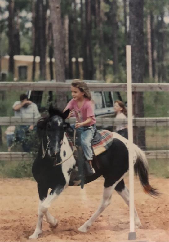 A girl riding a horse