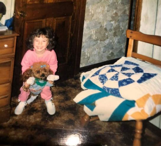 A girl holding a dog