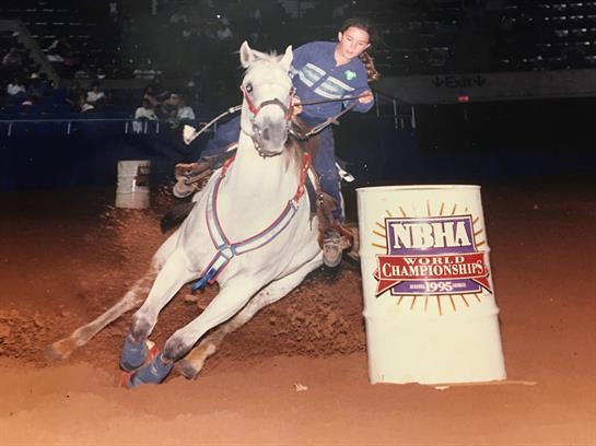 A woman riding a horse