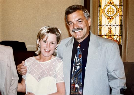 A man and woman posing for a picture