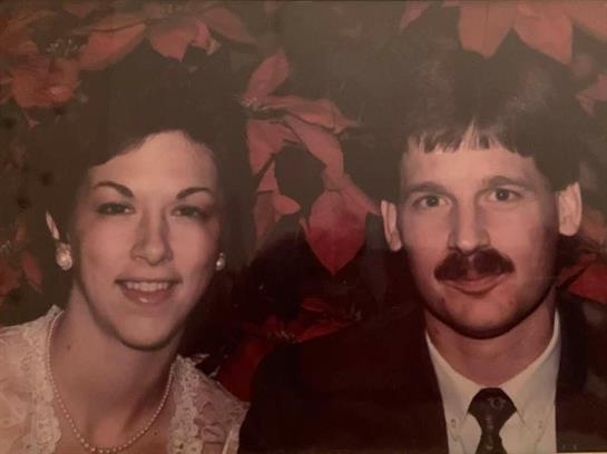 A man and woman posing for a picture
