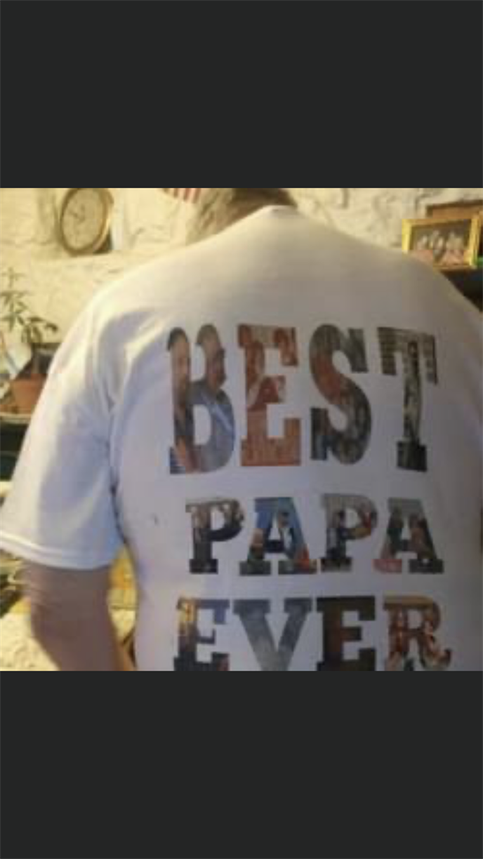 A person wearing a white shirt with words on it