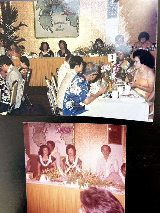 Guests gather at tables in the banquet hall, enjoying dinner and socializing amid decor.