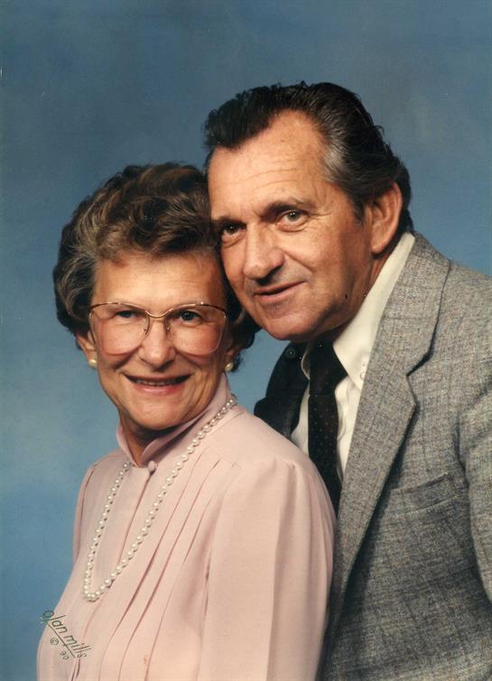 A man and woman posing for a picture