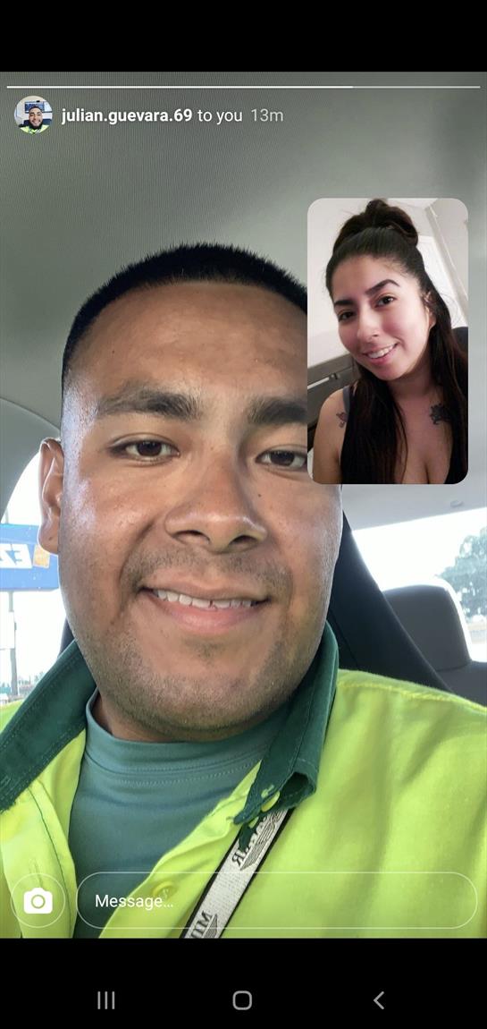 A man smiles for a selfie while video chatting with a woman displayed on his phone.