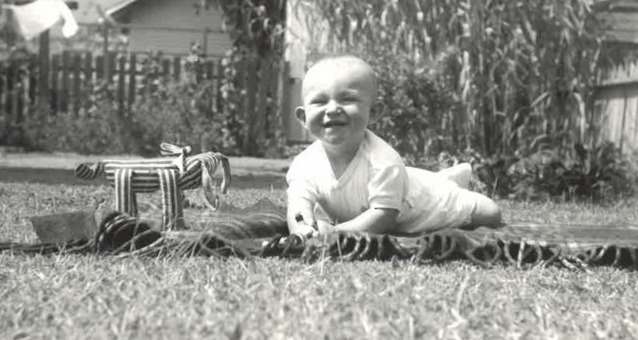 A baby lying on a blanket