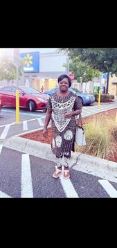A woman standing on a crosswalk