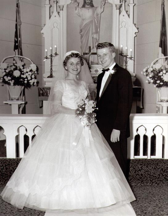 A man and woman in wedding attire