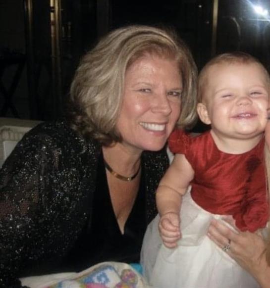 A woman holding a baby