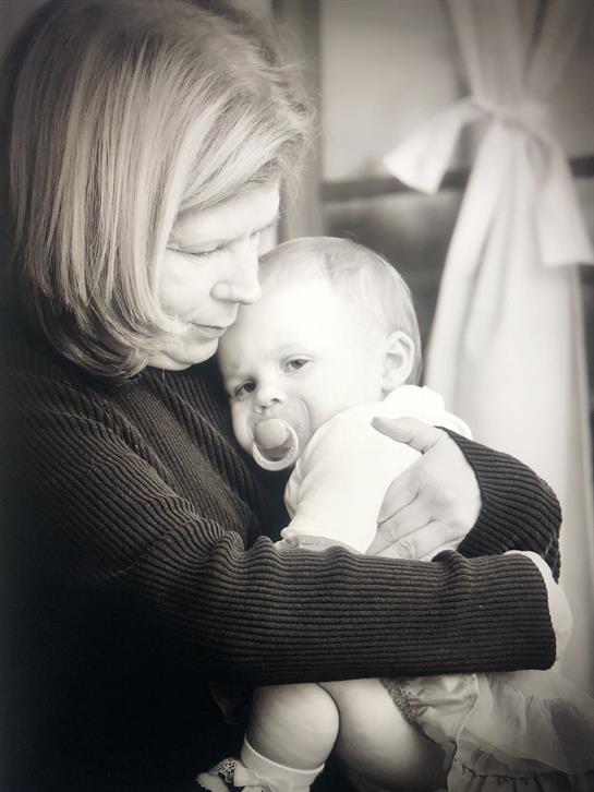 A woman holding a baby