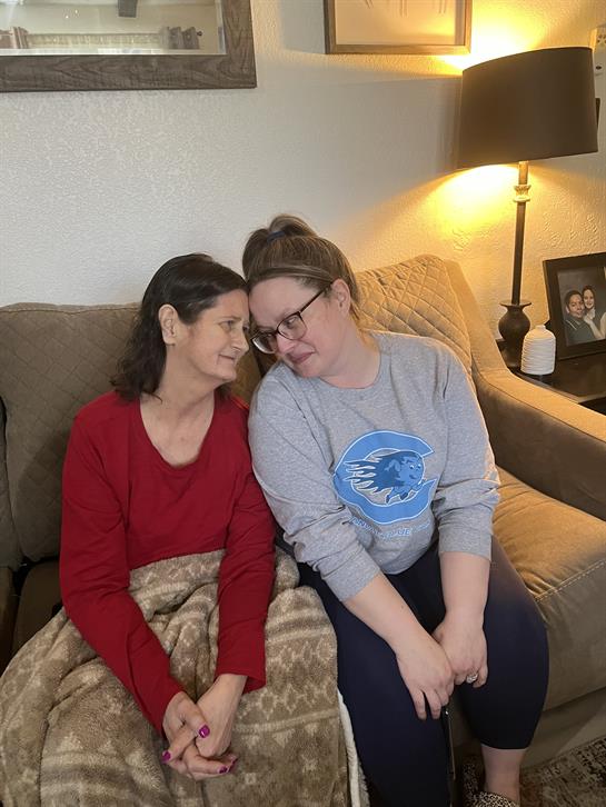 Two women sitting on a couch