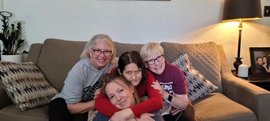 A group of women sitting on a couch