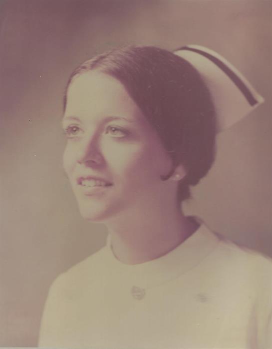A woman in a nurse's hat