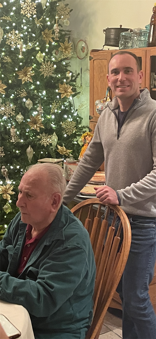 A man standing in front of an old man