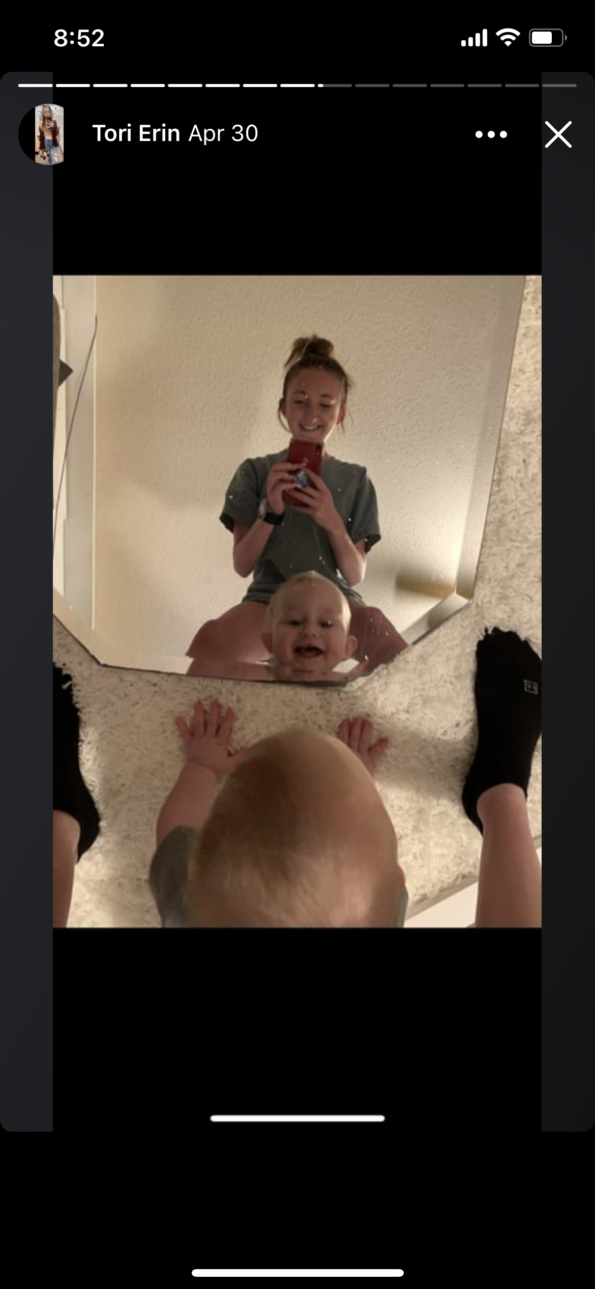 A woman and a baby taking a selfie