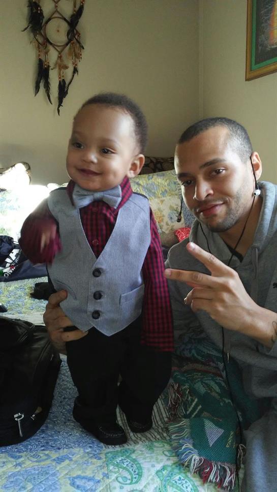 A man and a child posing for a picture