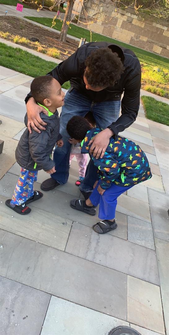 A man and two children