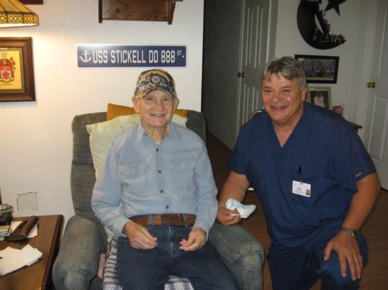 A man and woman sitting in a chair