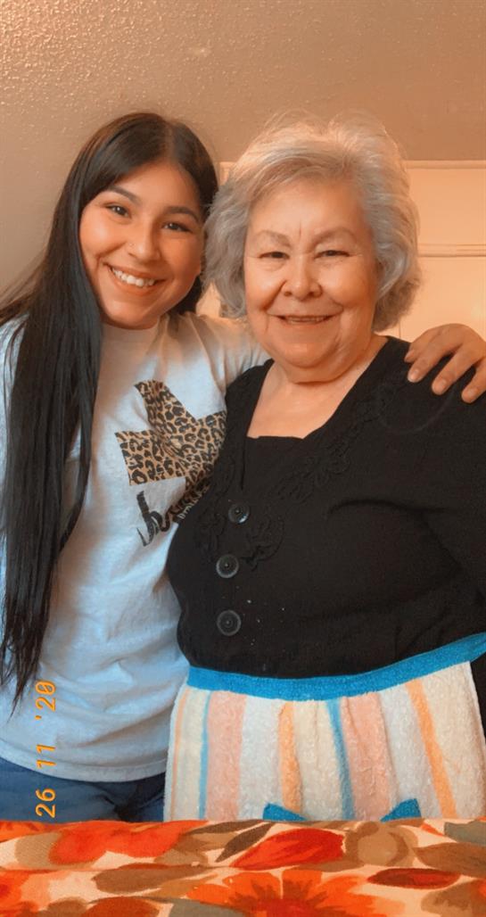A woman and a girl posing for a picture