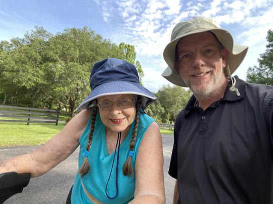 A man and woman wearing hats