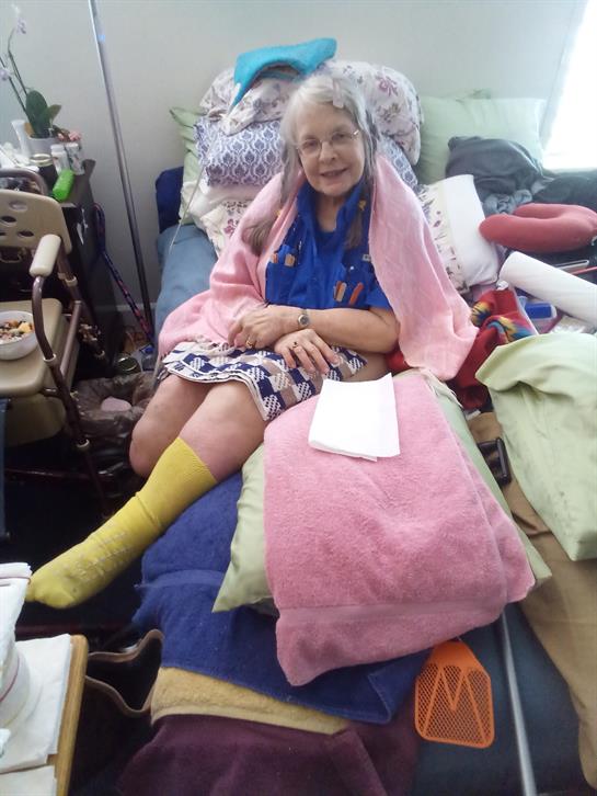 A woman sitting on a bed