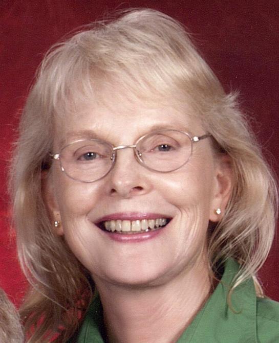 A close-up of a woman smiling