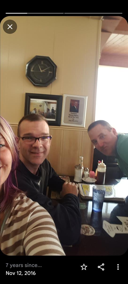 A group of people sitting at a table