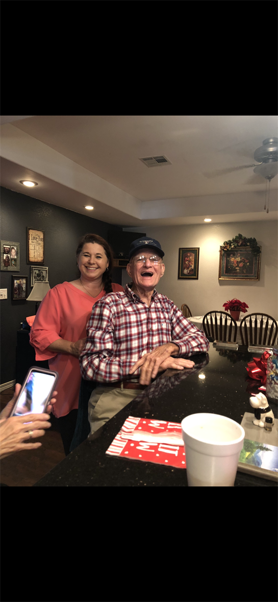 A man and woman posing for a picture
