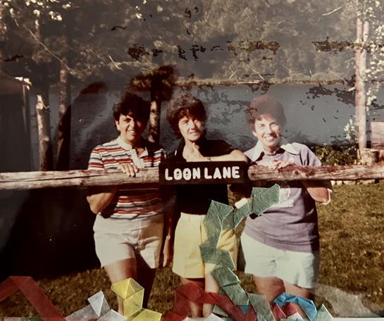 A group of people holding a sign