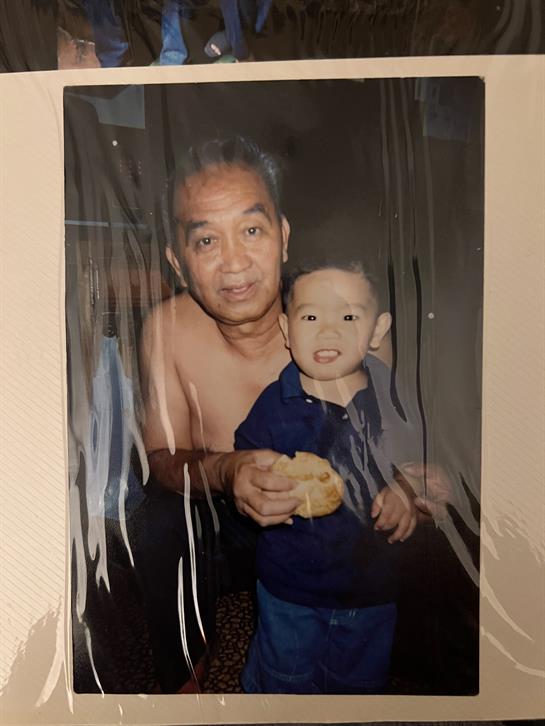 A man holding a boy