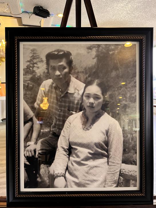 A black and white photo of a man and woman in a frame
