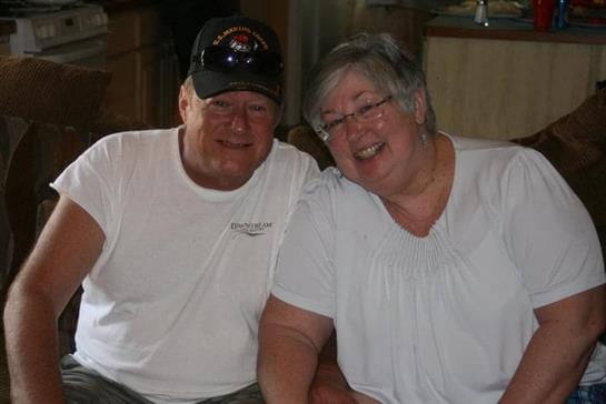 A man and woman smiling