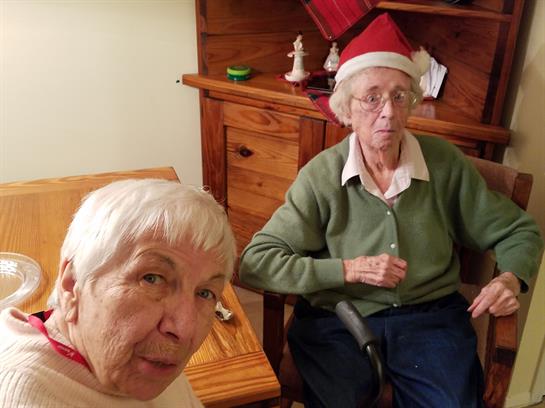 Two women sitting in a chair