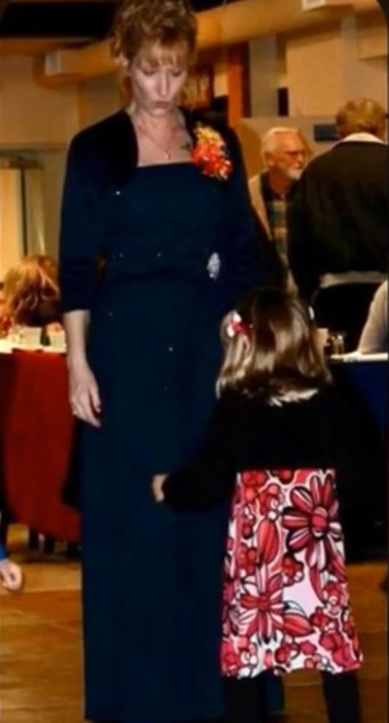 A woman and child standing in a room